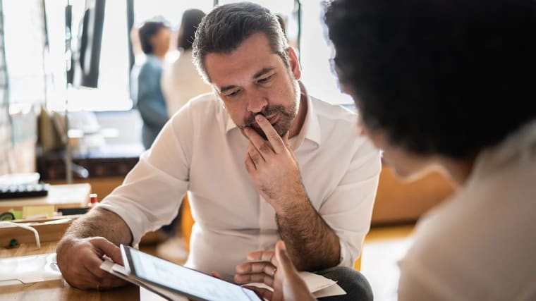 A consultant reviewing findings with a client