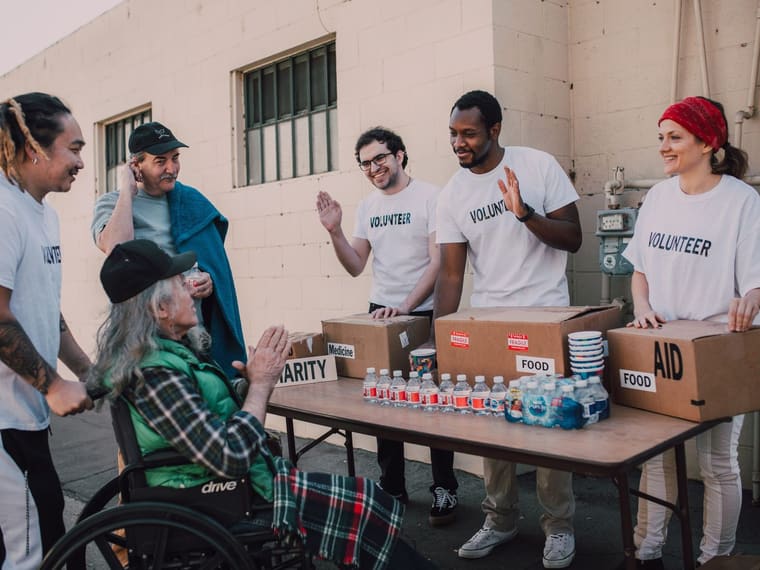 Volunteers sorting donations together at a table