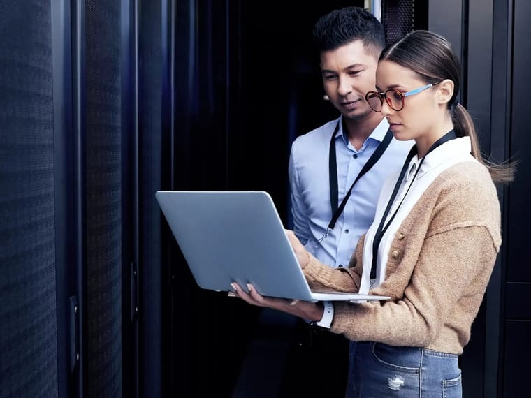 Two engineers checking infrastructure