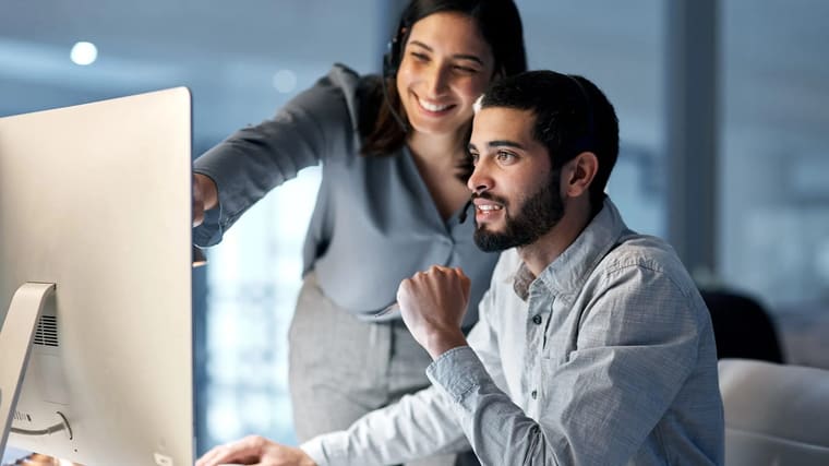 A Sentry CTO technician helping a client at their computer